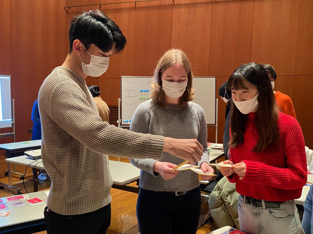 Players negotiating with SDGs Card Game