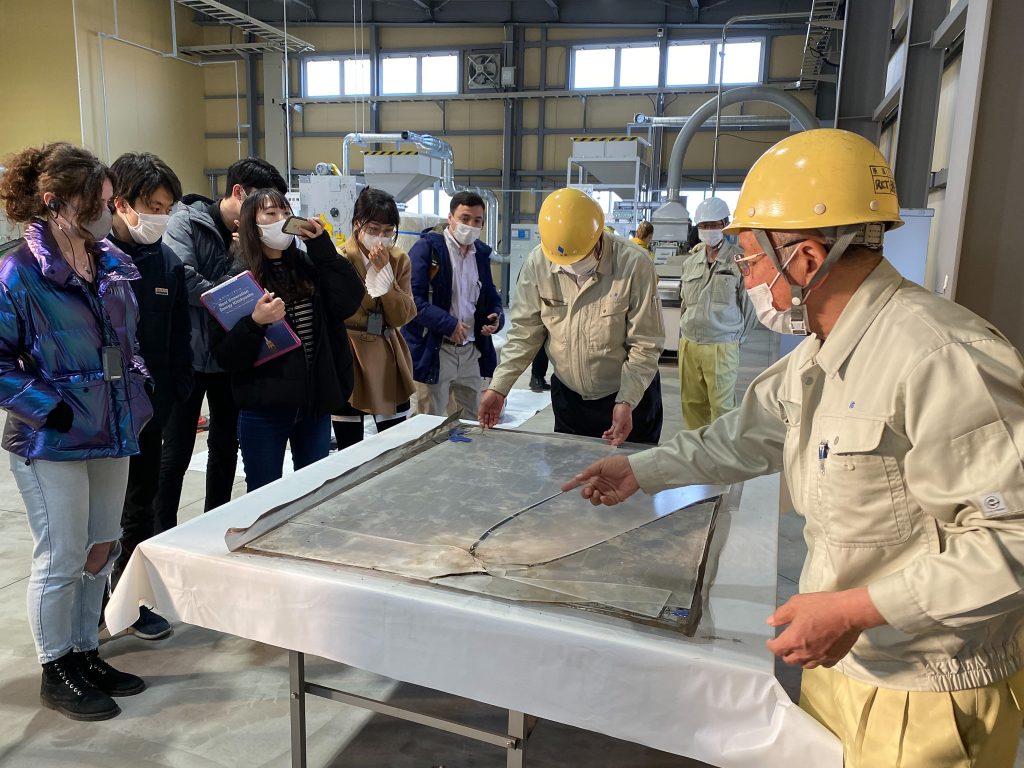 Mr. Koshiji explains about a broken solar panel
