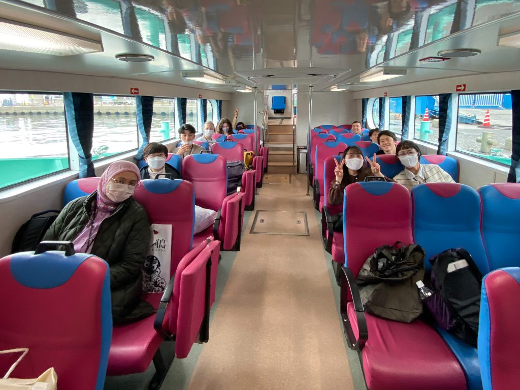 Participants seat in the ship