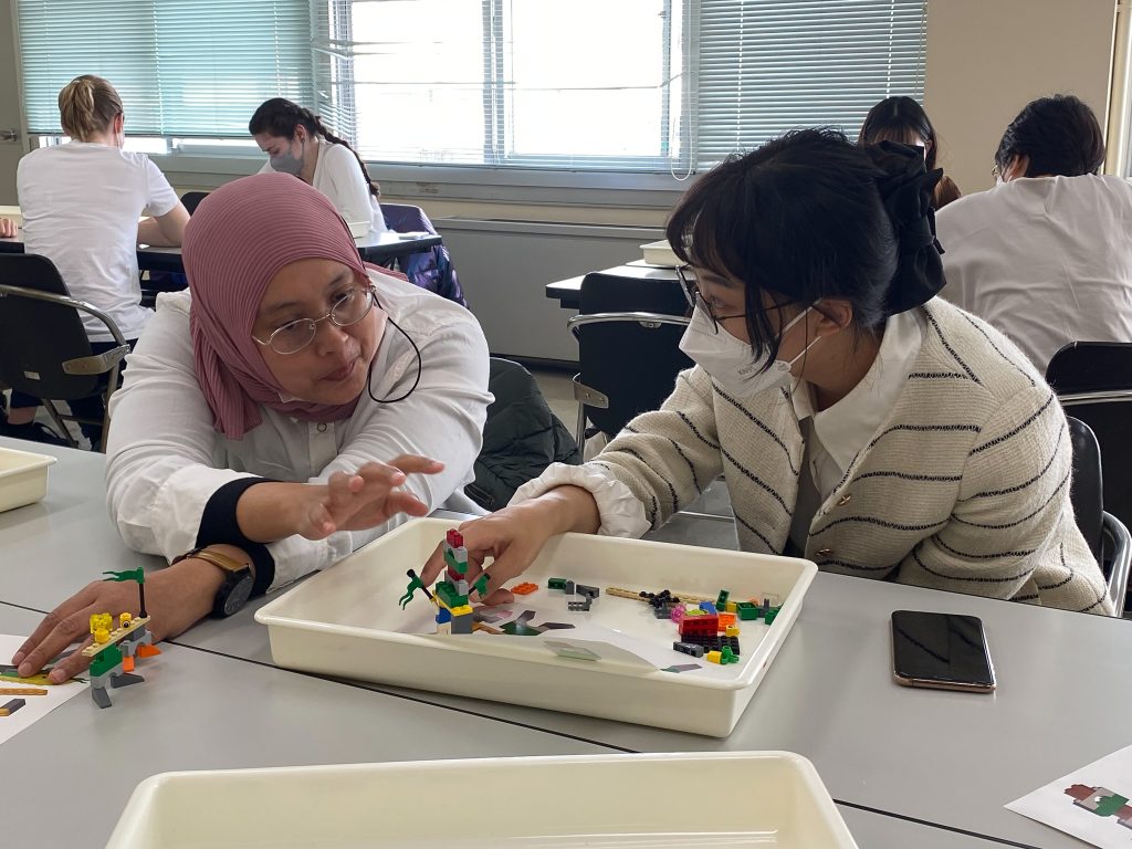 Participant asks a question to another participant about LEGo serious play
